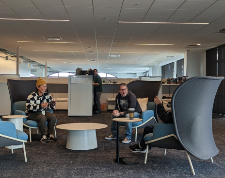People sitting and talking in an open office
