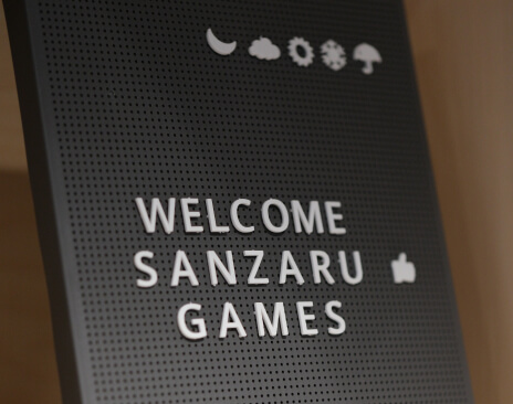 A photo of a book cover that says Welcome Sanzaru Games
